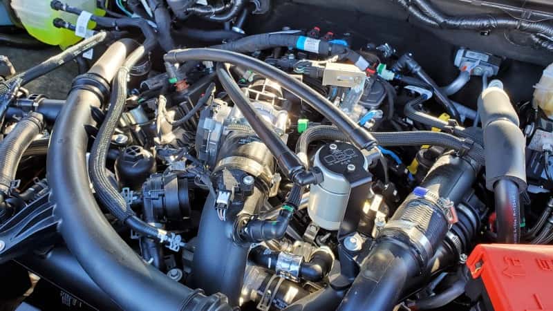 J&L — J&L 24-25 Ford Ranger 2.7L EcoBoost PCV Side Clear Anodized
Oil Separator - view 3