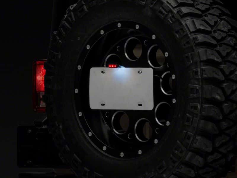Raxiom — Raxiom 07-18 Jeep Wrangler JK Axial Series License Plate Bracket w/ LED Brake Light
Mount - view 2