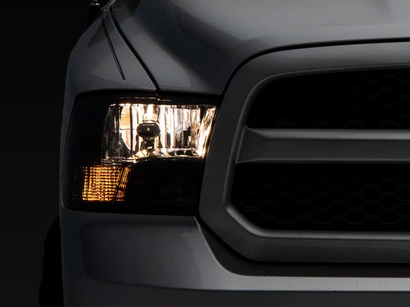 Raxiom — Raxiom 09-18 Dodge RAM 1500 Axial OEM Rep Headlights w/ Dual Bulb- Chrome Housing (Smoked Lens )
Headlights - view 1
