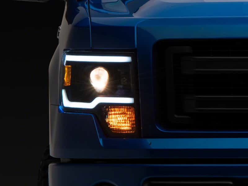 Raxiom — Raxiom 09-14 Ford F-150 Axial Series Projector Headlights w/ LED Light Bar- Blk Housing (Clear Lens)
Headlights - view 1