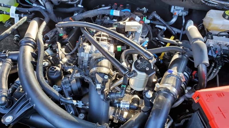 J&L — J&L 24-25 Ford Ranger 2.7L EcoBoost PCV Side Clear Anodized
Oil Separator - view 2