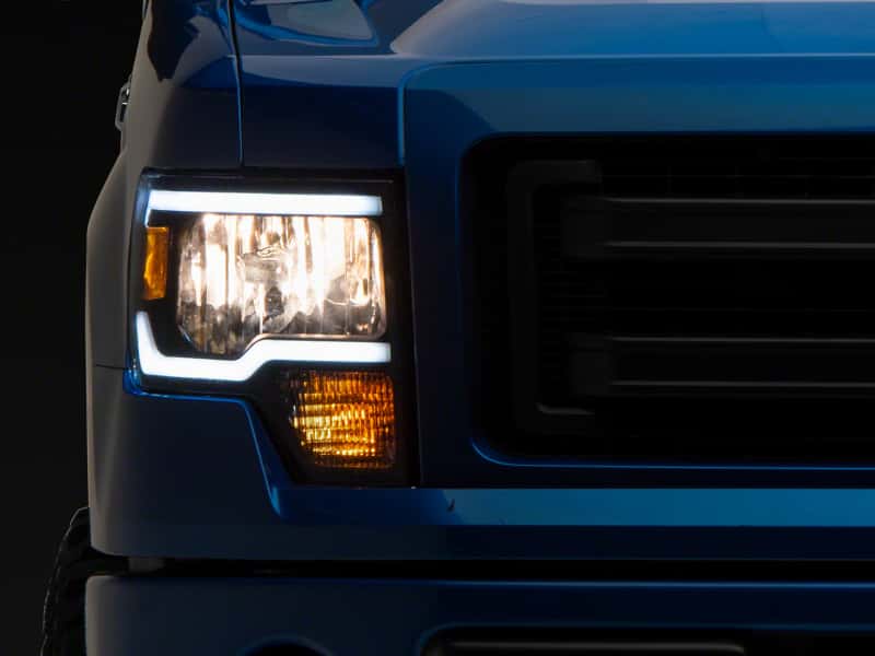 Raxiom — Raxiom 09-14 Ford F-150 Axial Series Headlights w/ LED Bar- Blk Housing (Clear Lens)
Headlights - view 1