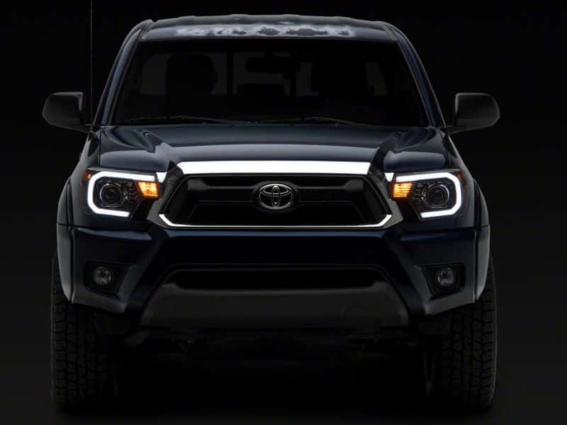 Raxiom — Raxiom 12-15 Toyota Tacoma Axial Projector Headlights w/ SEQL LED Bar- Blk Housing (Clear Lens)
Headlights - view 12