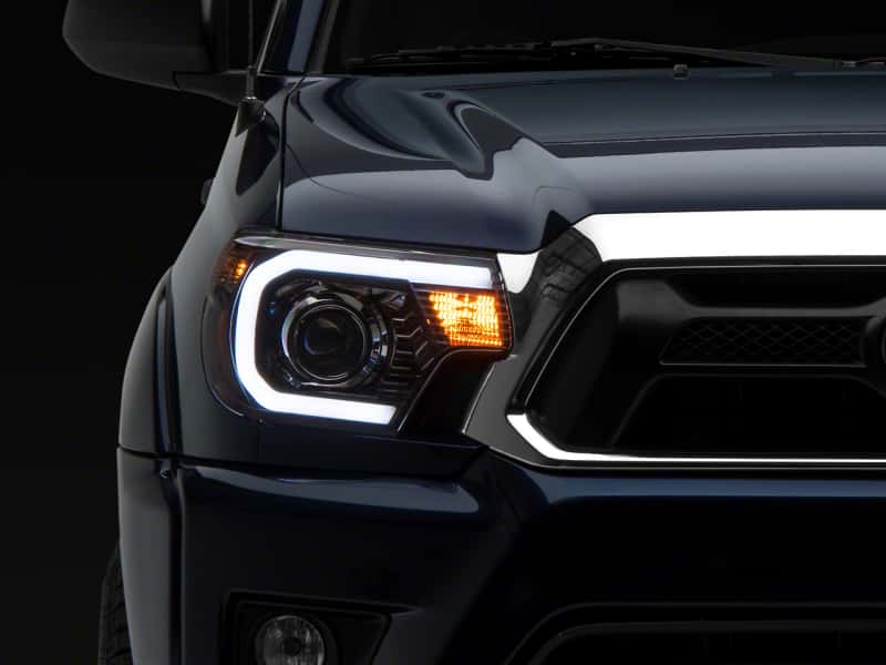 Raxiom — Raxiom 12-15 Toyota Tacoma Axial Projector Headlights w/ SEQL LED Bar- Blk Housing (Clear Lens)
Headlights - view 1