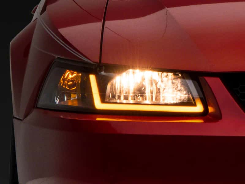 Raxiom — Raxiom 99-04 Ford Mustang Axial Series Headlights w/ Sequential LED Bar- Blk Housing (Clear Lens)
Headlights - view 1