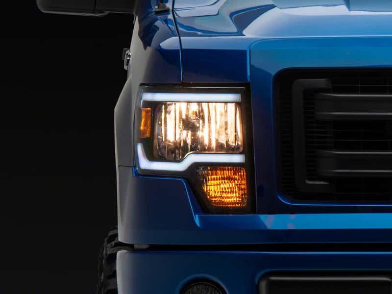 Raxiom — Raxiom 09-14 Ford F-150 Axial Series Headlight w/ SEQL LED Bar- Blk Housing (Clear Lens)
Headlights - view 1