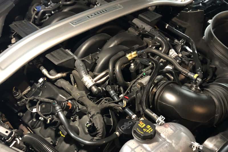 J&L — J&L 2018-2023 Ford Mustang GT Passenger Side Oil Separator 3.0 - Black Anodized
Oil Separator - view 3