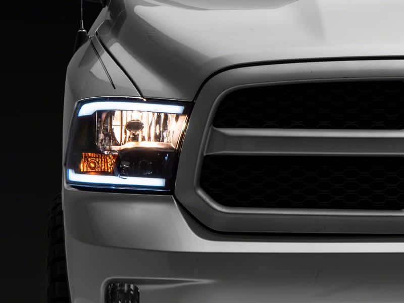 Raxiom — Raxiom 09-18 Dodge RAM 1500/2500/3500 Axial Series Headlights w/ LED Bar- Blk Housing (Clear Lens)
Headlights - view 1