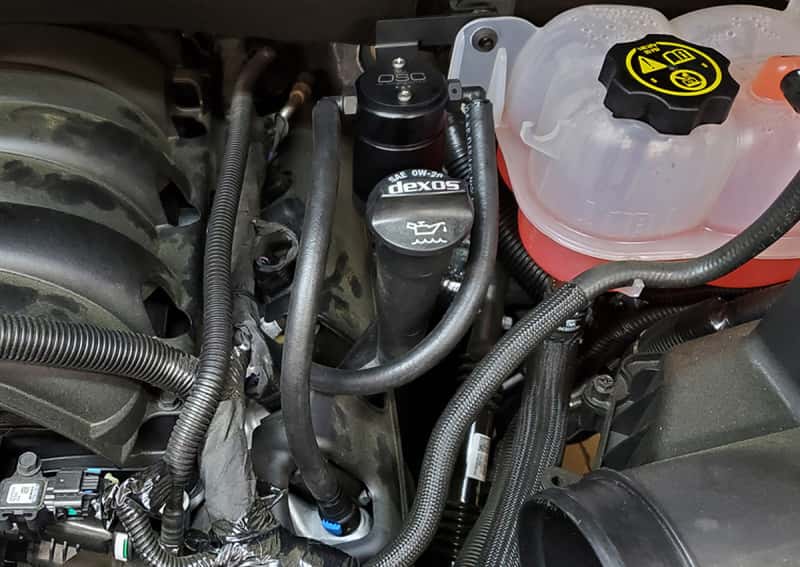 J&L — J&L 19-26 Chevrolet Silverado/GMC Sierra 1500 5.3L V8 Driver Side Oil Separator 3.0 - Black Anod
Oil Separator - view 2