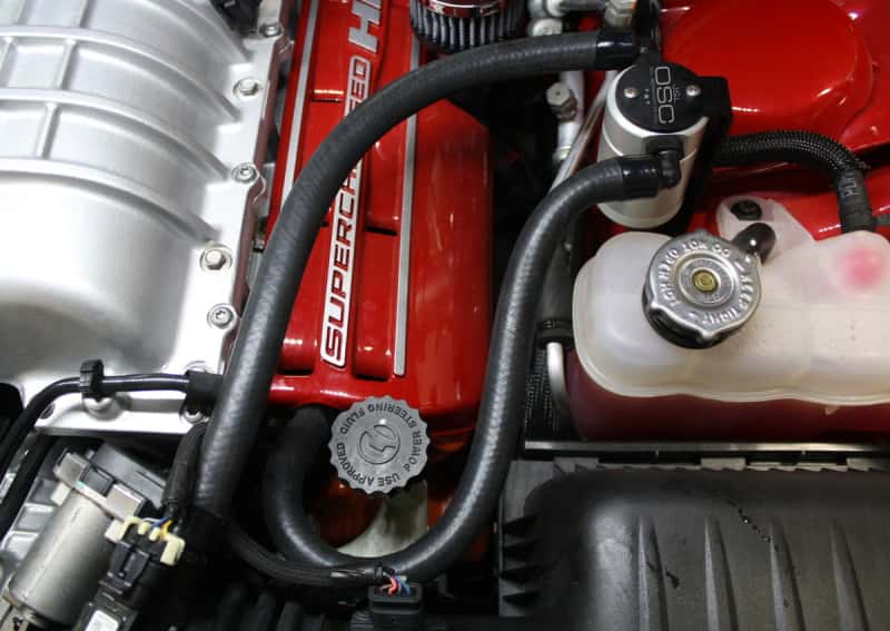 J&L — J&L 15-17 Dodge Hellcat 6.2L Hemi Driver Side Oil Separator 3.0 - Clear Anodized
Oil Separator - view 1