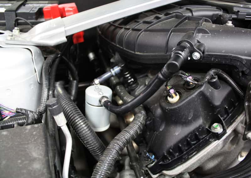 J&L — J&L 11-17 Ford Mustang V6 Passenger Side Oil Separator 3.0 - Clear Anodized
Oil Separator - view 2
