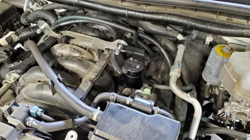 J&L — J&L 17-24 Nissan Armada / 14-24 Infiniti QX80 5.6L Driver Side Oil Separator 3.0 - Black Anodize
Oil Separator - view 2