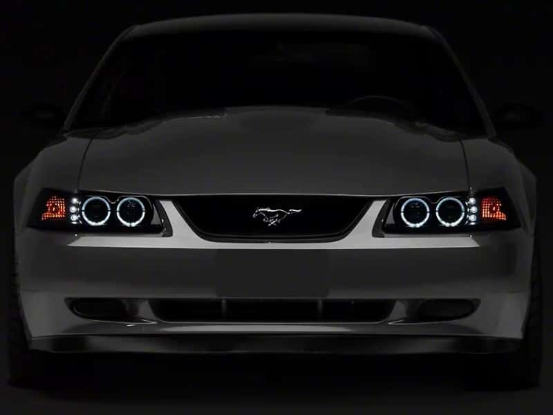 Raxiom — Raxiom 99-04 Ford Mustang Dual LED Halo Projector Headlights- Black Housing (Smoked Lens)
Headlights - view 1