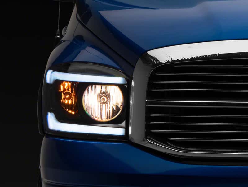 Raxiom — Raxiom 06-09 Dodge RAM 1500/2500/3500 Axial Headlights w/ SEQL LED Bar- Blk Housing (Clear Lens)
Headlights - view 1