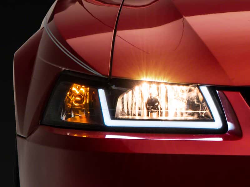 Raxiom — Raxiom 99-04 Ford Mustang Axial Series Headlights w/ LED Bar- Blk Housing (Clear Lens)
Headlights - view 1