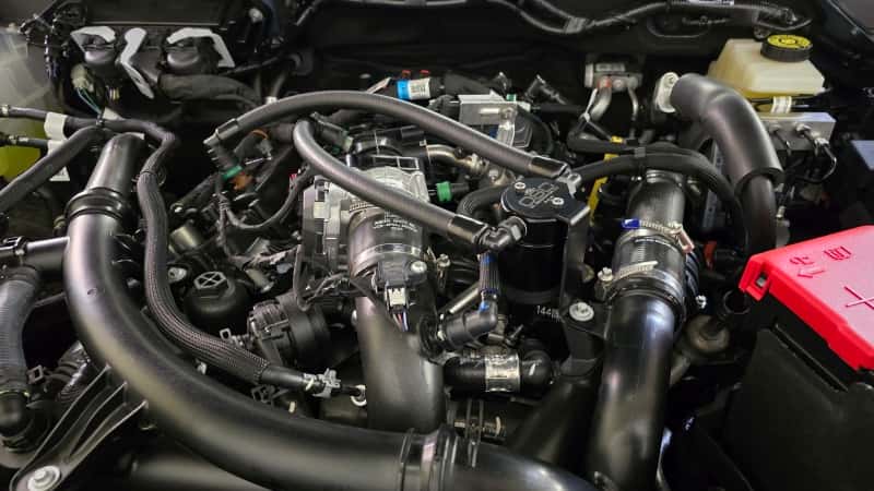 J&L — J&L 24-25 Ford Ranger 2.7L EcoBoost PCV Side Black Anodized
Oil Separator - view 2