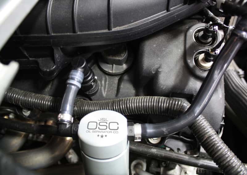 J&L — J&L 11-17 Ford Mustang V6 Passenger Side Oil Separator 3.0 - Clear Anodized
Oil Separator - view 1