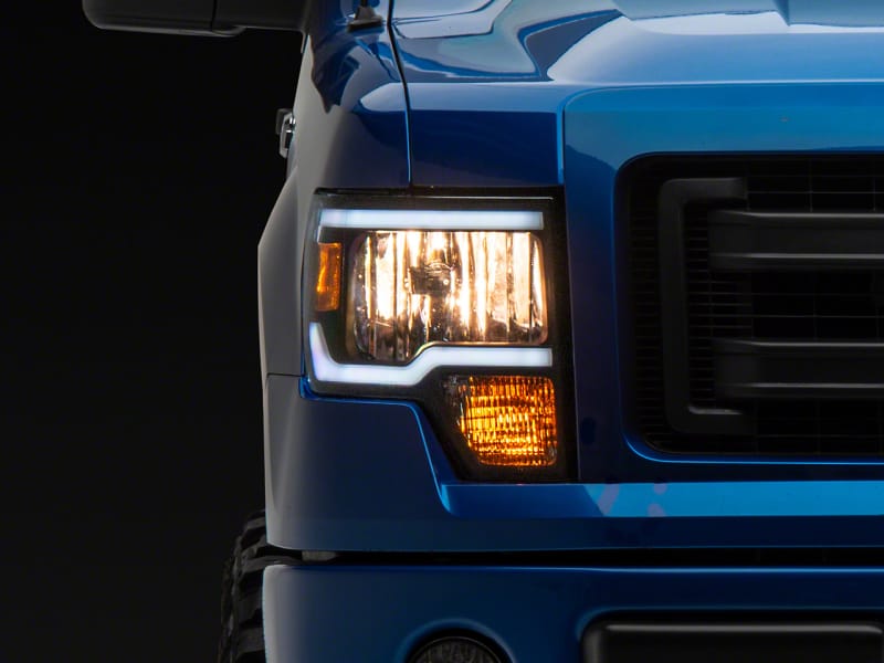 Raxiom — Raxiom 09-14 Ford F-150 Axial Series Headlight w/ SEQL LED Bar- Blk Housing (Clear Lens)
Headlights