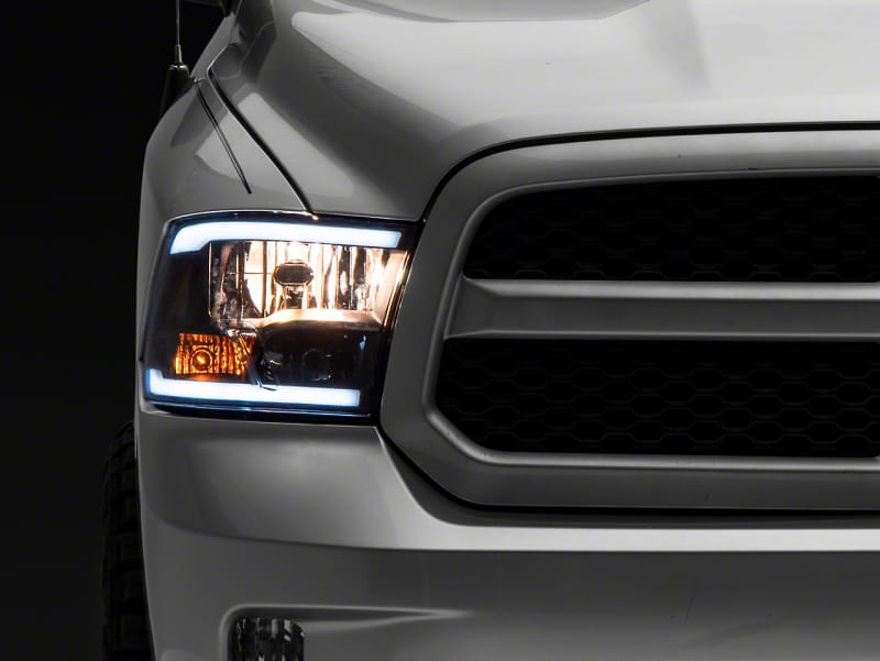 Raxiom — Raxiom 09-18 Dodge RAM 1500/2500/3500 Axial Series Headlights w/ LED Bar- Blk Housing (Clear Lens)
Headlights