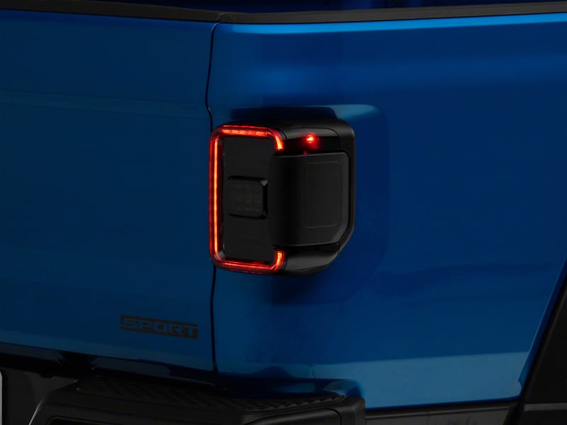 Raxiom — Raxiom 20-23 Jeep Gladiator JT w/ Factory Halogen LED Tail Lights- Blk Housing (Smoked Lens)
Lights