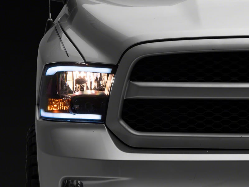 Raxiom — Raxiom 09-18 Dodge RAM 1500/2500/3500 Axial Headlights w/ SEQL LED Bar- Blk Housing (Clear Lens)
Headlights