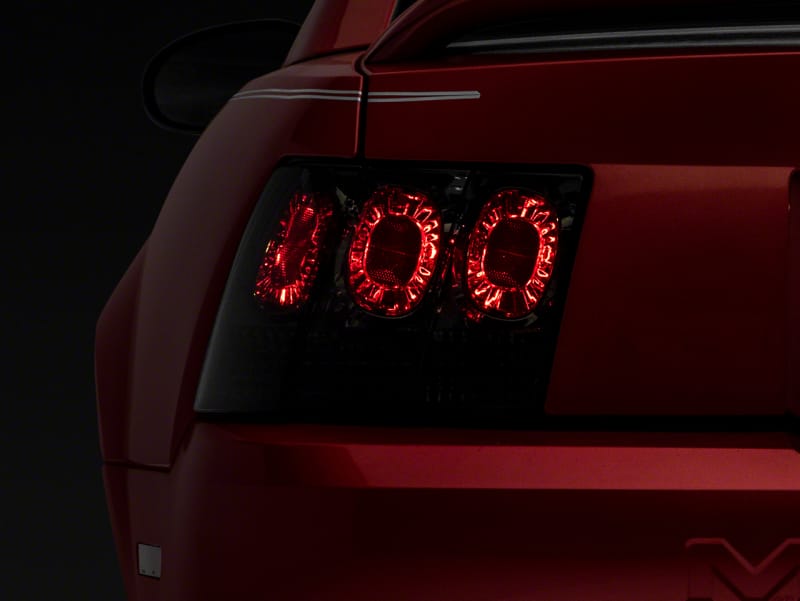 Raxiom — Raxiom 99-04 Ford Mustang Axial Series Altezza Style Tail Lights- Blk Housing (Smoked Lens)
Lights