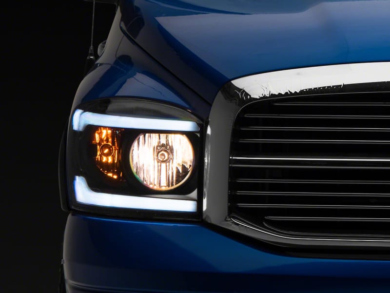 Raxiom — Raxiom 06-09 Dodge RAM 1500/2500/3500 Axial Headlights w/ SEQL LED Bar- Blk Housing (Clear Lens)
Headlights