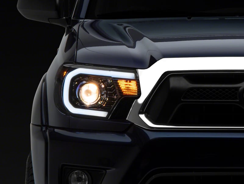 Raxiom — Axial Series Projector Headlights with LED Bar
Black Housing
Clear Lens