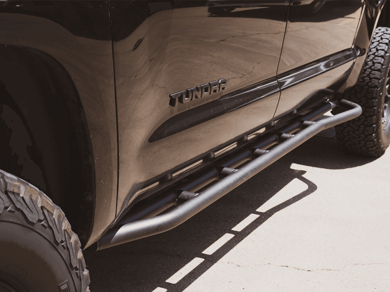 Cali Raised LED — Cali Raised 14-21 Toyota Tundra Trail Edition Rock Sliders - Kick Out / BedLiner